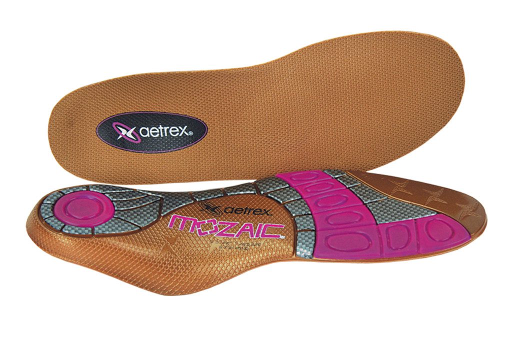 A pair of pink and brown insoles, also known as inserts.