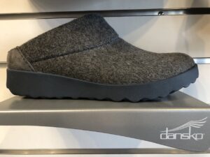 A gray slip-on shoe with dansko stand